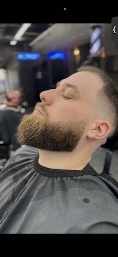 Full beard sculpt with a skin fade